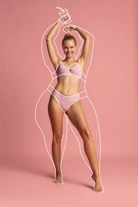 Young beautiful woman with perfect body shape in inner wear isolated over pink background. Concept of healthy eating Young beautiful woman in inner wear with perfect body shape and white lines around body before loosing weight isolated over pink background. Concept of healthy eating, dieting, weight, fitness, ad