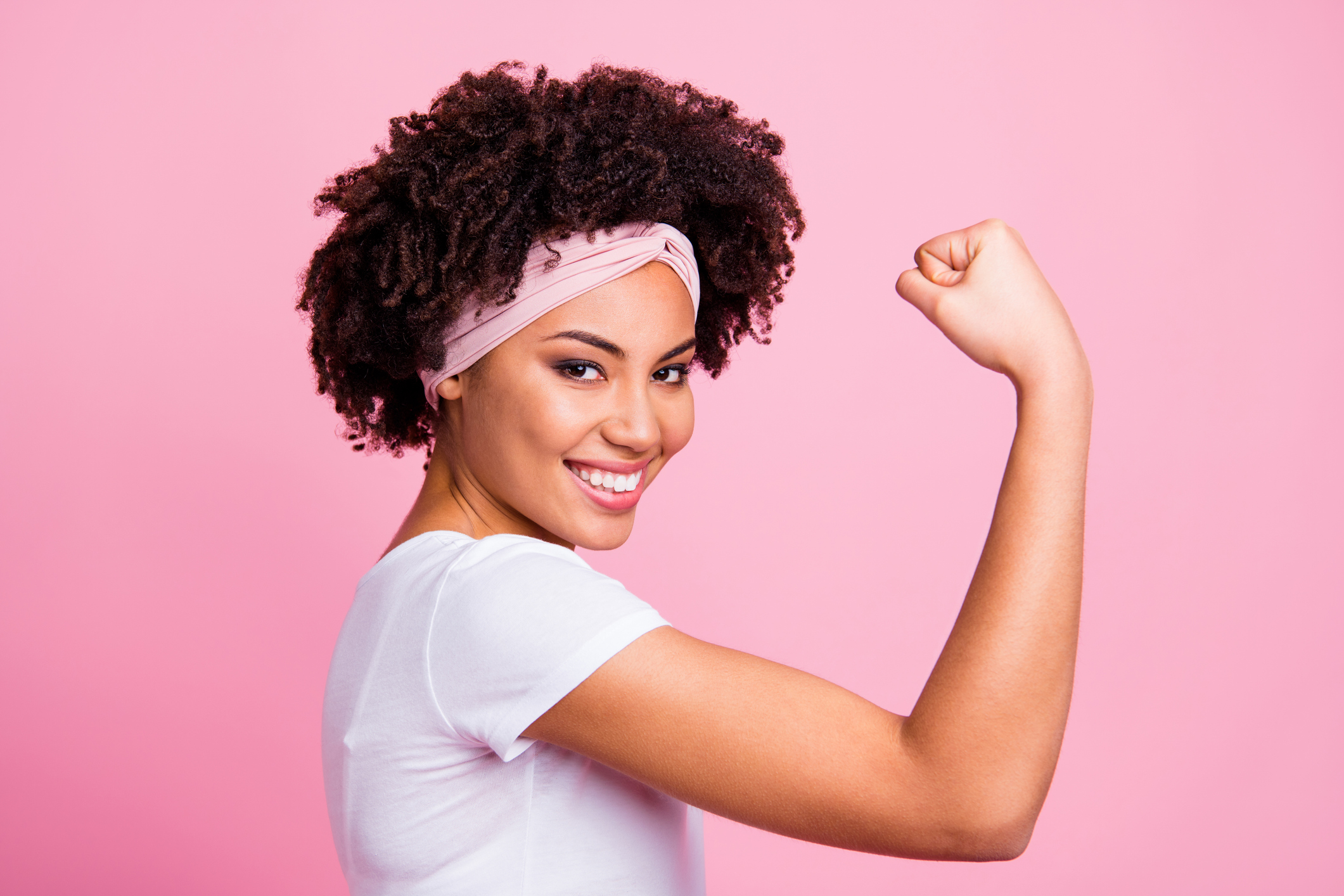 strong not skinny woman doing bicep muscle pose